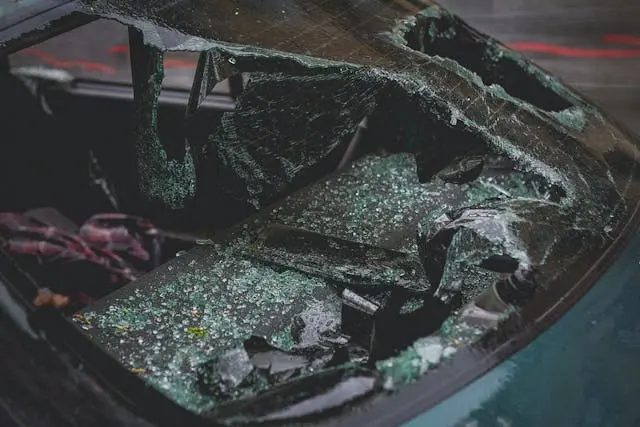 Photo of a totaled car. Shocking Crash in the Bronx: MTA Bus Crashes Into Multiple Cars, Leaving 7 Injured in Scene ‘Like a Movie’