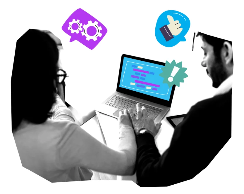 Two people using a laptop with code on screen.