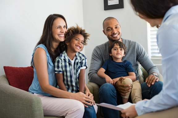 A family participates in a counseling session together