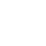 Close-up of a pressure washer nozzle cleaning a surface, illustrating a pressure washing service. The high-pressure spray is visibly lifting dirt and grime.