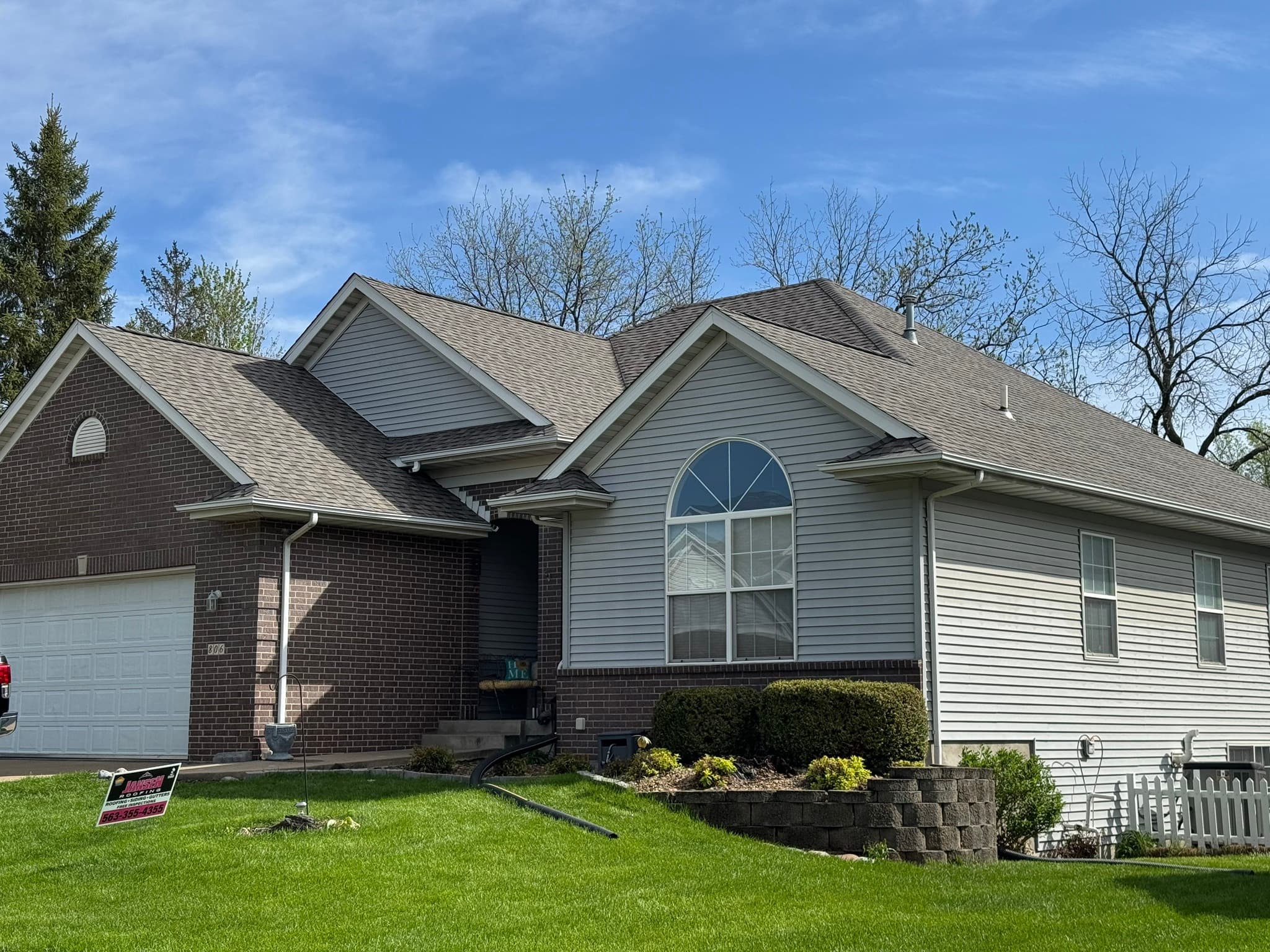 beautiful house white siding new shingles roof